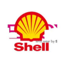 Shell service station with fuel pumps, car and Shell motor oil products at sunset